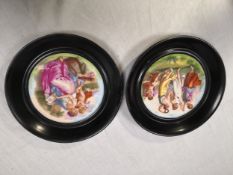 Two 19th century style wall hanging porcelain plates with printed decoration, one depicting the