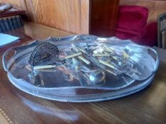 A silver plated galleried tray along with a miscellaneous collection of silver plated items. L.57cm