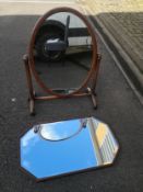 A 19th century mahogany swing mirror together with an octagonal oak framed wall mirror with a