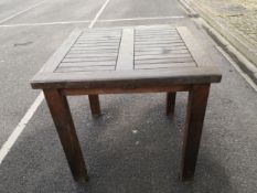 A contemporary weathered Chic Teak garden table with maker's label. H.76 W.80 D.80cm