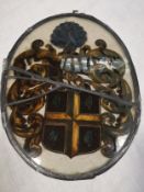 Two 19th century oval reverse glass paintings hand painted with coats of arms in lead surrounds with