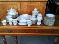 A 20th century Japanese Noritake porcelain part dinner service to include plates, bowls, cups and
