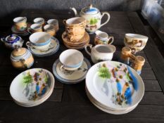 A mixed collection of 20th century Japanese porcelain to include hand painted teapots, cups,