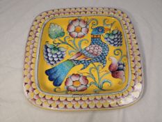 Two signed Italian Majolica decorative plates hand painted with images of birds among flowers.
