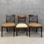 A pair of Regency mahogany cross back dining chairs with patterned calico upholstered seats on
