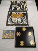 A collection of artworks to include a butterfly mosaic, a signed ceramic tile depicting penguins,