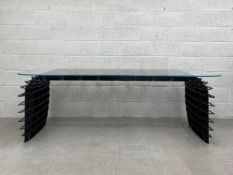 A contemporary Spitfire desk by Duffy London having a rectangular lozenge shaped toughened glass top