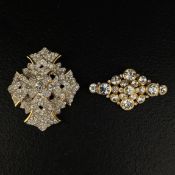 Two large vintage costume brooches to include an early Kenneth Jay Lane gold plated clear crystal