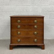 A Georgian mahogany bachelors chest having a rectangular thumb moulded top with a brushing slide