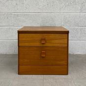 A mid-century Danish style teak chest by Stag Furniture having square top over two graduating