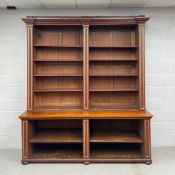 A large 19th century mahogany open library bookcase having a moulded breakfront cornice over and