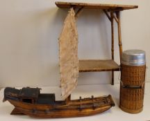 A Chinese model Junk ship or Sampan marked with Chinese characters along with a two tier bamboo