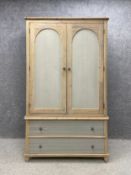 A contemporary lime-washed and painted ash wardrobe in the French provincial 19th century style