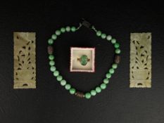 A 20th century Chinese green jade and filigree beaded necklace with an impressed auspicious