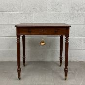 An early 19th century mahogany writing desk having a rectangular top with a secret compartment and