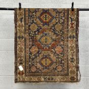 A 19th century Caucasian Shirvan Kuba rug having three diamond lozenge medallions surrounded by