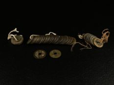A collection of 18th century Chinese Qing dynasty and later Qianlong Tongbao and other base metal