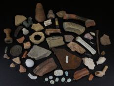 A large mixed collection of ancient artefacts to include a conical piece of terracotta from the