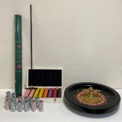 A contemporary roulette set complete with a roll out mat, wheel and chips in a fitted case. W.