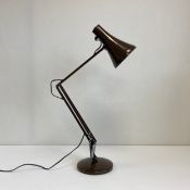 A contemporary brown painted Anglepoise table lamp with a maker's label. H.85cm