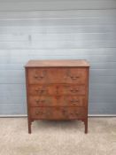 A 20th century Georgian style chest of drawers having a rectangular thumb moulded top above four