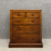 A 19th century mahogany chest of drawers having a rectangular thumb moulded top above two short over