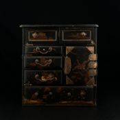 An 19th century Japanese Meiji period copper mounted black lacquered tabletop cabinet having a