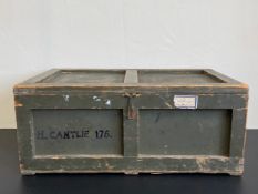 An early 20th century military style panelled pine trunk painted khaki green and bearing the hand