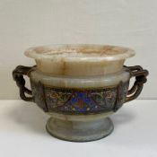 A 19th century French bronze mounted twin handled marble urn having a carved flat splayed rim over a