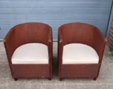 A pair of 20th century Lloyd Loom machine woven iron red painted kraft paper tub chairs each
