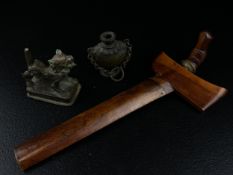A collection of three Oriental items to include a 19th century Tibetan cast bronze temple lion along