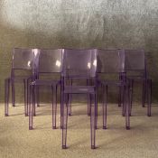 A set of six translucent purple shock and weatherproof polycarbonate Louis Ghost chairs designed