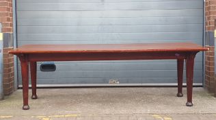 An early 20th century mahogany refectory style dining table having a large rectangular top raised