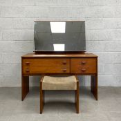 A mid-century Danish style teak dressing table by Stag having large adjustable mirror over an