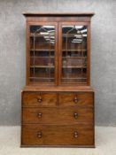 A 19th century mahogany library bookcase having a moulded cornice with a crossbanded frieze above