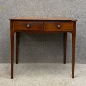 A Georgian mahogany side table having a rectangular crossbanded top over two short frieze drawers