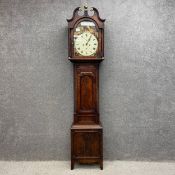 An 18th century Scottish mahogany longcase clock having a scrolling shaped and moulded breakfront