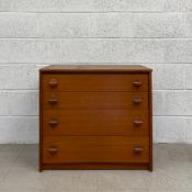 A mid-century Danish style teak chest of drawers by Stag having a rectangular top above four long