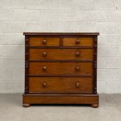 A 19th century mahogany chest of drawers having a rectangular top with a crossbanded edge above an