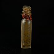 A small 19th century sealed cut glass bottle with gilt foliate decoration, possibly a 'tear catcher'