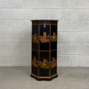A contemporary Indian school black lacquered octagonal floor standing ceremonial box hand painted