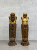 A pair of 20th century hand carved and gilt wood caryatids or corbels depicting a male and a