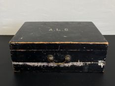 An early 20th century black painted pine box with a brass swan neck handle bearing the initials A.