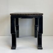 A 20th century Korean lacquered side table having a square brass bound top inlaid with a