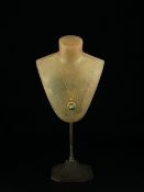 Three pieces of jewellery to include a .925 gold plated necklace with a turquoise cabochon in an