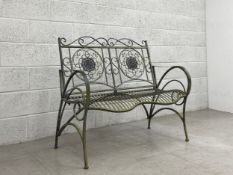 A contemporary 19th century style aluminium garden bench having a scrolling crested top rail and