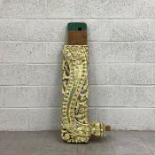 A 19th century Eastern painted architectural bracket or pediment carved all-over with scrolling