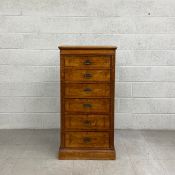 A 19th century walnut chest of drawers having a rectangular moulded top over six graduating