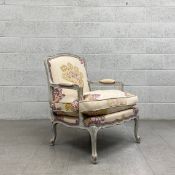 A contemporary 19th century French style armchair having a shaped and moulded distressed back and
