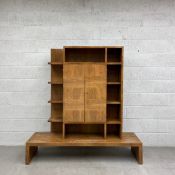 An early 20th century walnut Art Deco drinks or cocktail cabinet having a superstructure of twelve